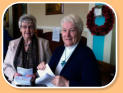 Mrs Ida Badger & Mrs Anne McGuffin greet Church visitors.